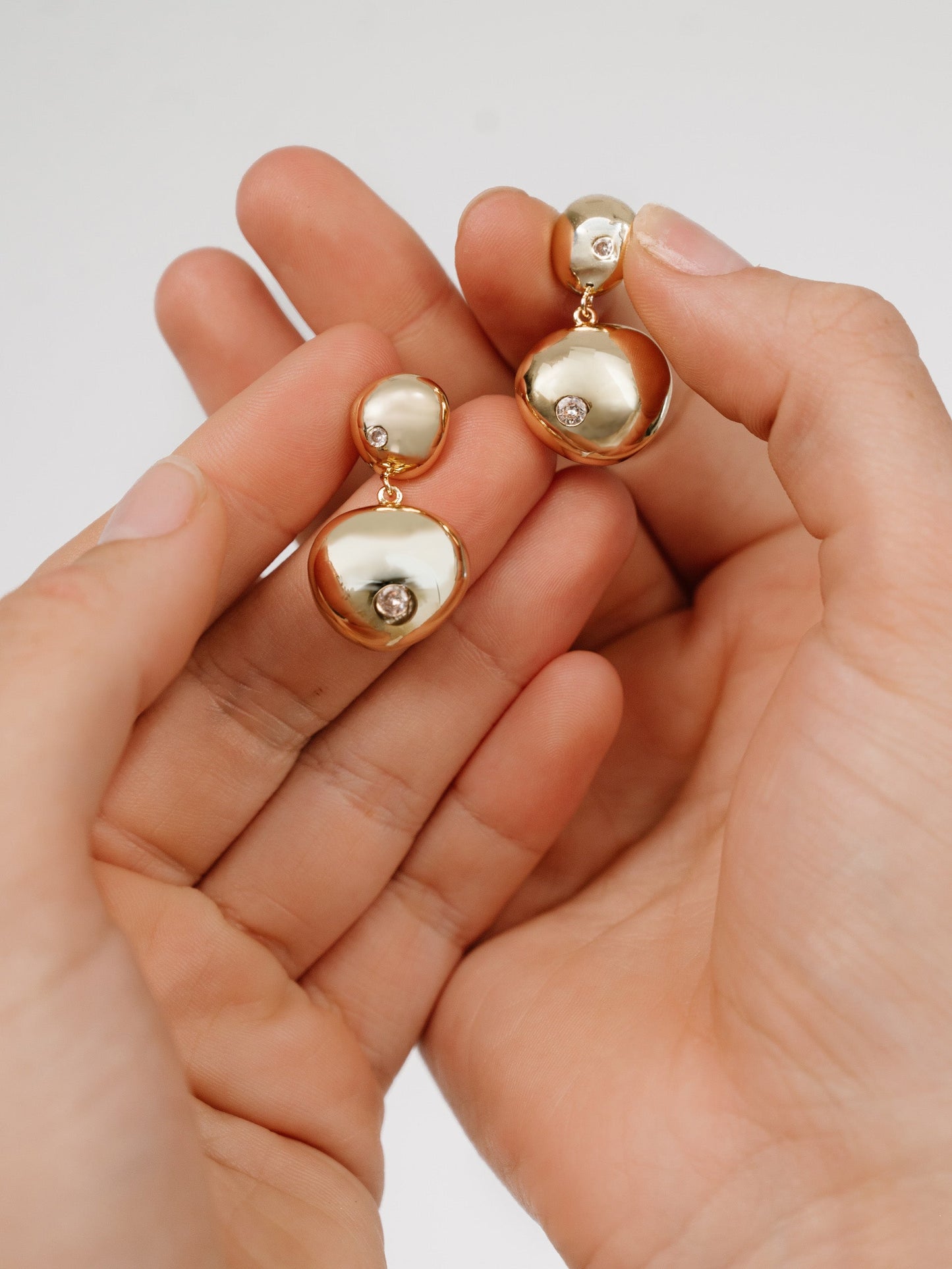 Boucles d'oreilles pendantes à double galet poli
