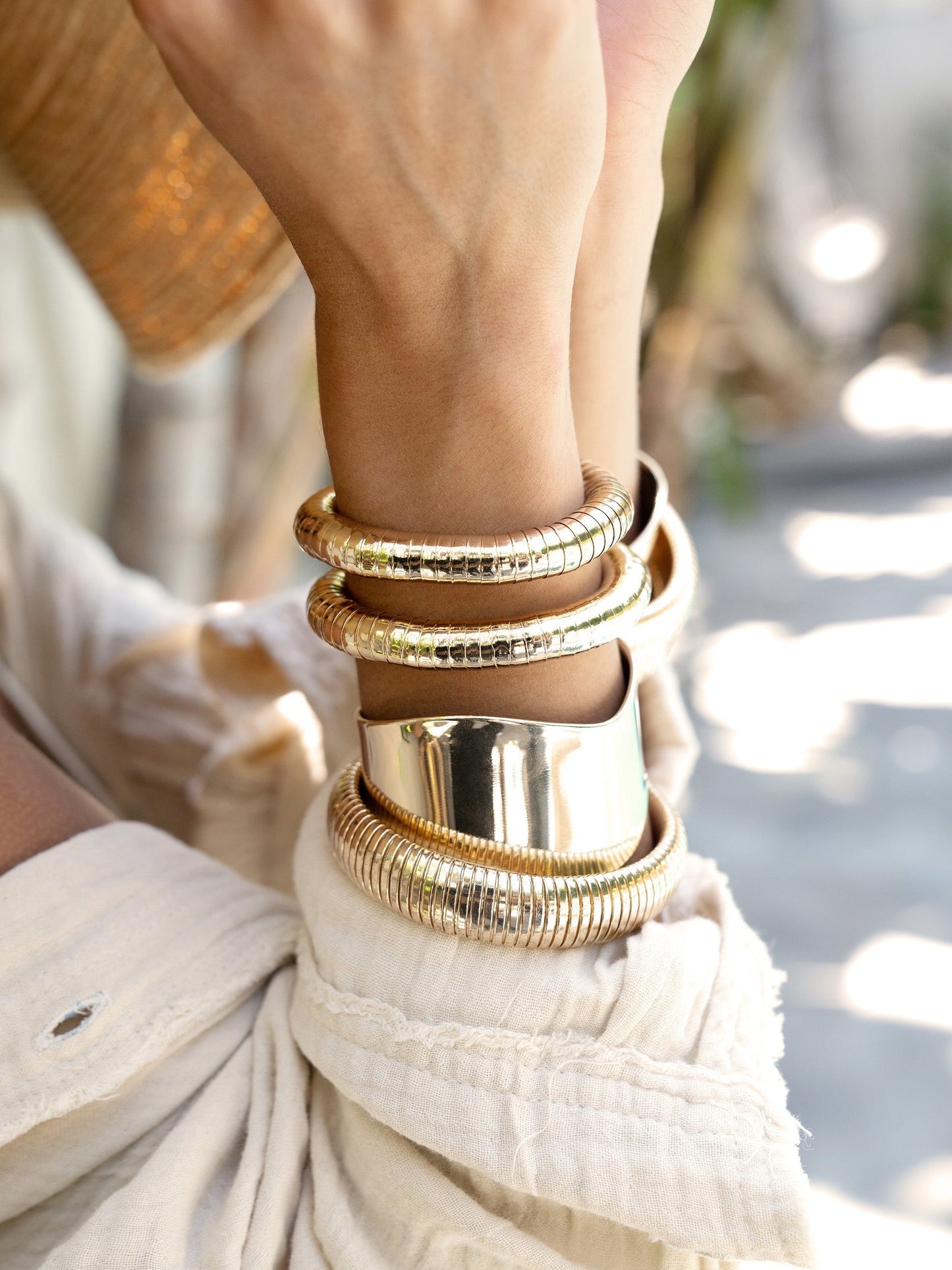 Ensemble de bracelets extensibles en or liquide