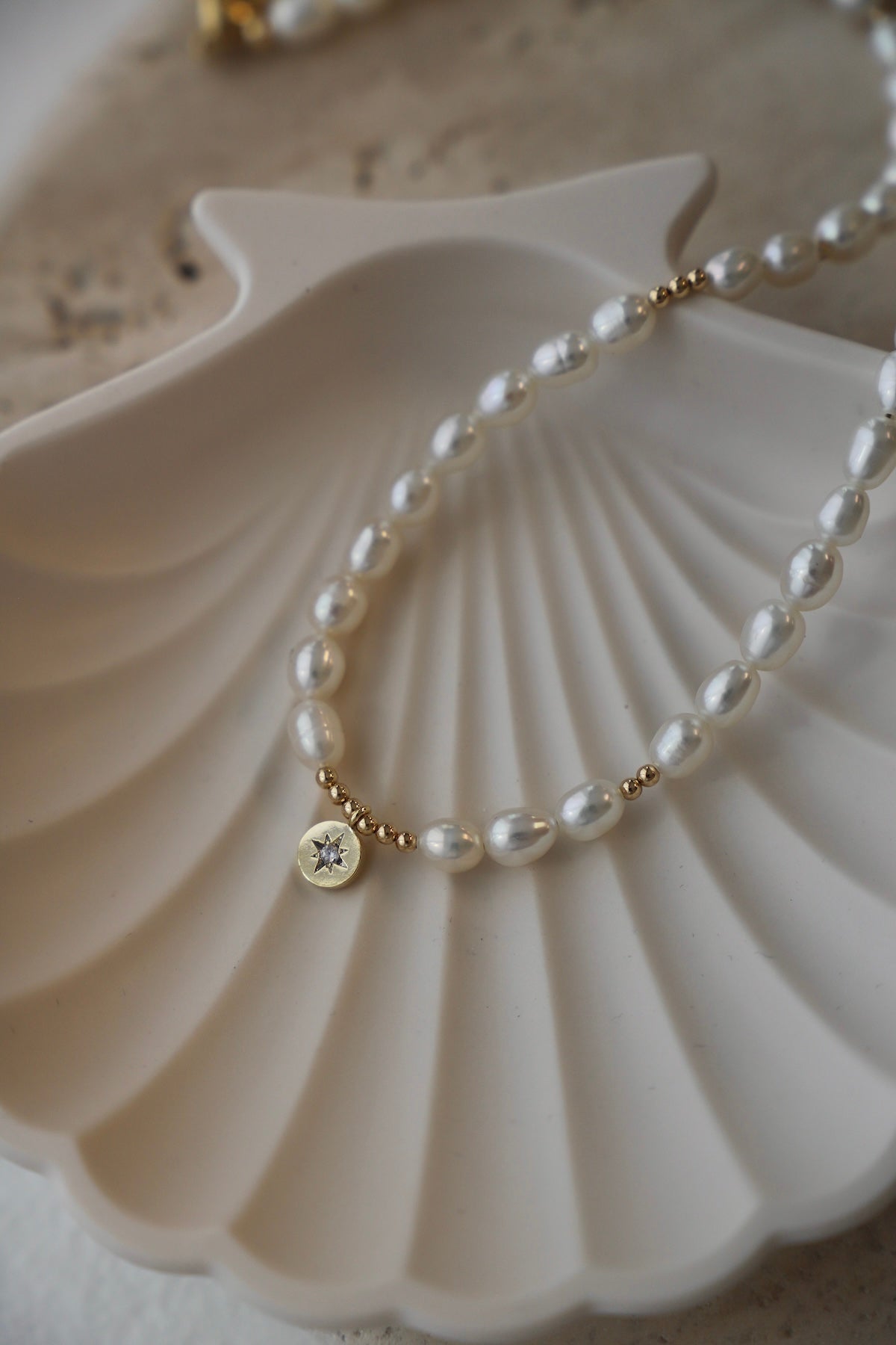 Collier médaillon étoile en perles